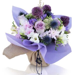 Seasonal flowers in water vase